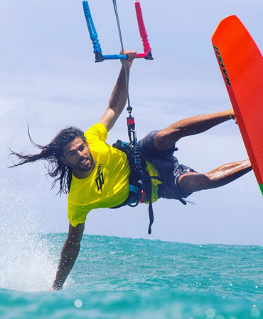 Advanced kitesurf rider performing a trick in Tarifa